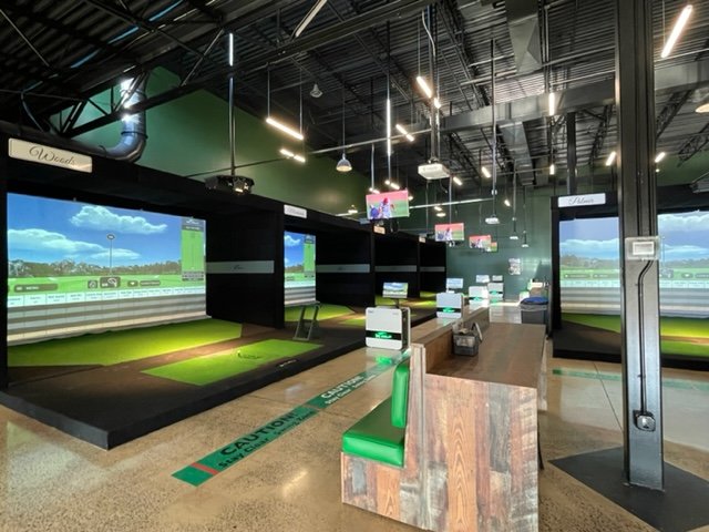 Clubhouse Sports Bar featuring X-Golf