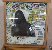 Image # 40337: Gold Mine Behind Backglass 
(The backglass is present but has so much paint peeling that very little artwork is left. Serial number 1729.)