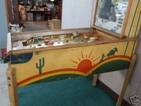 Image # 40343: Gold Mine Cabinet - Right 
(The backglass is present but has so much paint peeling that very little artwork is left. Serial number 1729.)