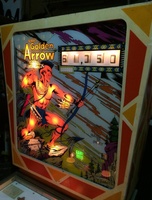 Image # 65298: Golden Arrow Sample Game - Illuminated Backglass 
(The red areas of this backglass have faded to white. Serial number 01002S.)