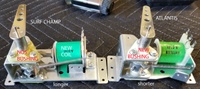 Image # 70782: Atlantis Flipper Mechanism Comparison - Annotated 
(A sample Atlantis game used shorter flipper mechanisms than the production games. Shown here is a mechanism from a Surf Champ game which is the same mechanism used on Atlantis production games. The replacement coil and bushing are immaterial to this comparison.)