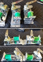 Image # 70783: Atlantis Flipper Mechanism Comparison 
(A sample Atlantis game used shorter flipper mechanisms (right side) than the production games. Shown here is a mechanism from a Surf Champ game (left side) which is the same mechanism used on Atlantis production games. The replacement coil and bushing shown here are immaterial to this comparison.)