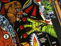 Image # 45312: Grand Lizard Playfield - Detail 
(This is a New Old Stock playfield in its crate from the manufacturer.)