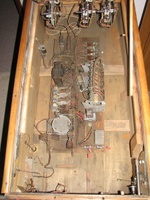 Image # 69504: Auto Race Inside Cabinet 
(The relay in the clear plastic case, to the right of the motor, is a replacement for the relay that was there and is not original to this game. Serial number E14989AR.)