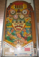Image # 31923: Hawaiian Isle Playfield - Pleasure Isle 
(A mini-post located between and below the flippers in this example was likely added by an operator who also moved the outlane mini-posts from their original positions. Operators in Italy were known for substituting the flattop pop bumper caps in place of the starburst ones.)