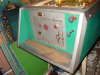 Image # 19980: Jungle Cabinet - Front 
(The cabinet shown here has been repainted a solid green but is included to show its other features. The red button directly above the key lock is not original to this game. Pressing it starts play. Its necessity is unclear: the factory-installed start button is to the left of the coin door.)