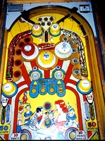Image # 1281: Kewpie Doll Playfield 
(The two passive bumpers at the top are missing their rubber rings. Nearby, a large rubber ring was subtituted for the three correct smaller ones.)