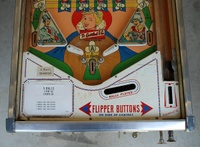 Image # 54259: Kings & Queens Lower Playfield 
(The white price card is not original to this game. It is made By Bally Mfg. Corp.)
