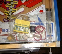 Image # 32282: Lady Luck Playfield Detail And Spare Parts 
(The game in this image was described to us as being newly removed from its original shipping carton. Note the blue film covering the metal side rail.)