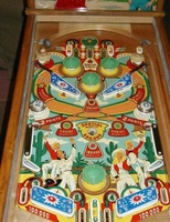 Image # 23814: Lazy-Q Playfield 
(The flyer indicates that the bumpers caps and flippers are gold. The only gold parts evident on the game pictured here are two bumper caps.)