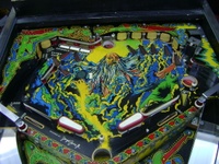 Image # 60791: Lightning Upper Playfield 
(The artist's name can see seen in the light blue area above the tip of the right flipper.)