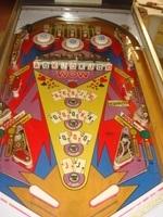 Image # 52728: Lucky Card Playfield - Modified Inlanes 
(On this game, the open elbow inlanes have been replaced with the standard closed-lane wireforms and the outlane mini-posts have been removed.)