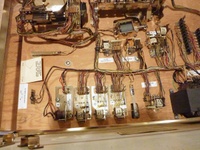 Image # 67436: Majorettes Sample Game - Motor Board - Detail 
(Metal parts have been cleaned and polished. The white rectangular labels are reproduction. Serial number 01006 S.)