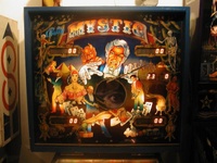 Image # 10505: Mystic Early Production Backglass 
(In this early backglass version, the center eye is recessed into the backbox and, when lit, creates a 3-D effect. This image is from the game with serial number EMY1060, the 60th game produced.)