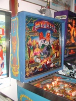 Image # 10506: Mystic Early Production Backglass 
(In this early backglass version, the center eye is recessed into the backbox and, when lit, creates a 3-D effect. This image is from the game with serial number EMY1060 (shown in the upper left of the backbox), the 60th game produced. The center drop targets have the wrong design for this game.)