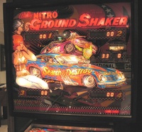 Image # 37007: Nitro Ground Shaker Illuminated Backglass 
(This game has a plastic composite playfield.)