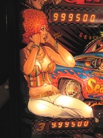 Image # 37008: Nitro Ground Shaker Illuminated Backglass - Detail 
(This game has a plastic composite playfield.)