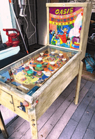 Image # 79152: Oasis Cabinet - Right 
(The toggle switch above the backglass is not original to this game. The cabinet has been stripped of its paint.)
