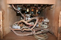 Image # 56359: OXO Inside Cabinet 
(The back of the cabinet has been removed. The coin door lock can be seen at the far end of this view.)