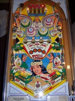 Image # 31457: Paradise Sample Game - Playfield 
(Not discernable in this image, the highest point of each flipper inlane has the words '10 points' painted over in yellow. A thin red arrow still points outward from this area. Serial number '01081 S'.)