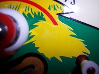 Image # 31479: Paradise Sample Game - Factory Paint-over 
(The words '10 points' apparently had a green background and were painted over in yellow. A thin red arrow still points outward from this area. Serial number '01081 S'.)