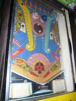 Image # 42736: Planets Playfield - After-Factory Pop Bumpers 
(The pop bumpers are not original to this game. The center spinning disk came from the factory with only one post on it. From the game with numbers 99609 and 99611.)