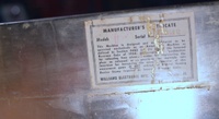 Image # 69189: Planets Manufacturer Certificate 
(The certificate shows serial number 99612. Note that the stamped Model number 'Zodiac' is overscored with the letter 'P' for 'Planets'. Located inside the front cabinet wall at bottom end of playfield.)