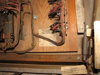 Image # 45764: Pleasure Isle No Replay Counter 
(The card stapled here to the wood normally fits over the replay counter on replay games to be visible through the open coin door during collection. Serial number 08195.)