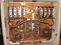 Image # 45760: Pleasure Isle Inside Backbox 
(On the game pictured here, the bell assembly to the right of center is missing its bell. Serial number 08195.)