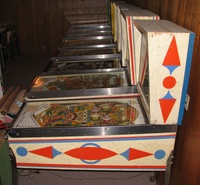 Image # 45765: Pleasure Isle Cabinet - Right 
(The thin blue strip of wood at the rear edge of the backbox is not original to this game. Serial number 08195.)