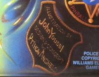 Image # 63792: Police Force Backglass - Detail 
(The artist and designer names are shown here.)