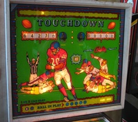 Image # 38997: Quarterback Pre-Production Backglass 
(It is believed this glass was made by Ad Posters for a pre-production presentation of this game. This glass was re-installed into a Quarterback backbox for this photo.)
