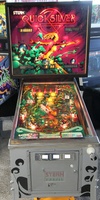 Image # 63794: Quicksilver Illuminated Front View 
(The three coin insert plates were not original to this game.)