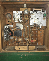 Image # 79676: Red Shoes Inside Backbox 
(A light bulb is missing from the socket and would shine through the rectangular hole in the insert to illuminate the backglass.)