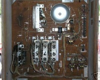Image # 32543: Reserve Inside Backbox 
(A bell and coil assembly is missing from the upper left corner of the insert.)