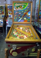 Image # 52405: Rocket Cabinet - Front View 
(The triangular post between the flippers is not original, and would be round. The red flipper above this post is not original and we do not know if it operates. The posts in the lower left and right corners of the playfield have been moved from their original positions.)