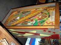 Image # 52400: Rocket Playfield 
(The triangular post between the flippers is not original, and would be round. The red flipper above this post is not original and we do not know if it operates. The posts in the lower left and right corners of the playfield have been moved from their original positions.)
