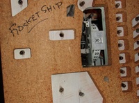 Image # 70400: Rocket Ship Game Over Lamp Hole 
(Where the lamp is missing in this picture, neither a lamp socket or wiring was installed by the factory.)