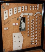 Image # 70399: Rocket Ship Backbox Insert - Unused Game Over Feature 
(In this picture, a red straw has been inserted into the hole where neither a lamp socket or wiring was installed by the factory.)