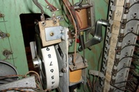 Image # 70401: Rocket Ship Game Over Lamp Hole 
(In this picture, a red straw has been inserted into the hole where neither a lamp socket or wiring was installed by the factory.)
