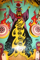 Image # 34840: Abra Ca Dabra Sample Game - Playfield - Detail 
(The small white lights shields at the bottom of this image may not be original to sample games. They do not appear on the flyer. Serial number 01015 S.)