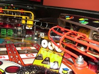 Image # 38885: Rollergames Atomic Whip Targets 
(The rose-colored plastic above the green drop targets is not original to this game.)