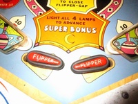 Image # 58008: Bazaar Flippers Closed 
(Bally manufactured this game using white flippers with white rubbers on them.)