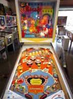 Image # 58011: Bazaar Cabinet - Front View 
(Bally manufactured this game using white flippers with white rubbers on them.)