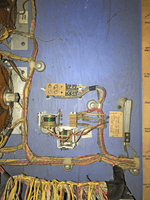 Image # 74612: Safari Replay Mode Shorting Plug Installed 
(In the wood near the jack, two starter holes can be seen where the optional Add-A-Ball Relay Assembly would be mounted. Serial number 1971.)