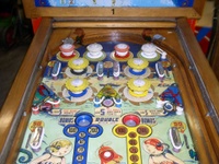 Image # 13624: Sea Belles Upper Playfield 
(Note that this playfield has had artwork added to it.  The gobble holes, lower side targets, pop bumpers rings, and upper ball arch have been modified.)