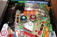 Image # 31656: Secret Service Upper Playfield 
(The two spinning targets do not match the game in the manufacturer's flyer. The bumper cap colors are reversed as well.)