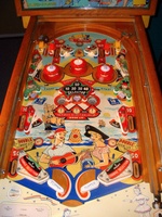 Image # 66231: Serenade Playfield 
(The owner states the pop bumpers caps, standup targets, and flippers are replacement parts.)
