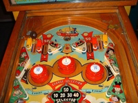 Image # 66232: Serenade Upper Playfield 
(The owner states the pop bumpers caps, standup targets, and flippers are replacement parts.)