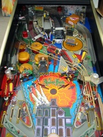 Image # 10151: The Addams Family Special Collectors Edition Playfield 
(Note that this machine includes a custom thing hand decal on thing's box, an Uncle Fester figurine in the electric chair, as well as a custom backdrop.)
